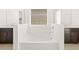 Bathroom with large soaking tub and double vanities at 36833 W La Paz St, Maricopa, AZ 85138