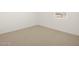 Simple bedroom with neutral carpeting and a window at 36833 W La Paz St, Maricopa, AZ 85138