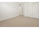 Bright bedroom with double door closet and neutral decor at 36833 W La Paz St, Maricopa, AZ 85138