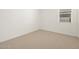 Bright bedroom with neutral carpeting and window at 36833 W La Paz St, Maricopa, AZ 85138