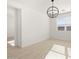 Bright dining room with chandelier and hardwood floors at 36833 W La Paz St, Maricopa, AZ 85138