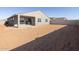 Single-story home with covered patio and sandy backyard at 36833 W La Paz St, Maricopa, AZ 85138