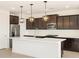 Contemporary kitchen with white countertops and dark cabinets at 36833 W La Paz St, Maricopa, AZ 85138