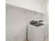 Laundry room with washer, dryer, and shelving at 36833 W La Paz St, Maricopa, AZ 85138