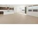 Living area with a view of the backyard through sliding doors at 36833 W La Paz St, Maricopa, AZ 85138