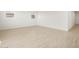 Bright living room with light wood floors and sliding glass door at 36833 W La Paz St, Maricopa, AZ 85138