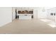 Open living room, kitchen, and dining area with light floors at 36833 W La Paz St, Maricopa, AZ 85138