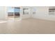 Spacious living room with access to a backyard patio at 36833 W La Paz St, Maricopa, AZ 85138