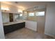 Bathroom featuring a large vanity and a walk-in shower at 19964 W Marshall Ave, Litchfield Park, AZ 85340