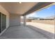 Outdoor covered patio offers shade with a view of a block wall and desert landscaping at 19964 W Marshall Ave, Litchfield Park, AZ 85340