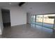 Bright living room with a large window and a sliding door offering plenty of natural light at 19964 W Marshall Ave, Litchfield Park, AZ 85340