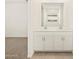 Modern bathroom features double sinks and white cabinets at 37422 W San Clemente St, Maricopa, AZ 85138