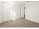 Bright bedroom featuring neutral carpeting and double door closet at 37422 W San Clemente St, Maricopa, AZ 85138