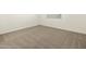 Simple bedroom with neutral carpeting and window at 37422 W San Clemente St, Maricopa, AZ 85138