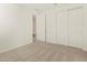 Bright bedroom with double door closet and access to hallway at 37422 W San Clemente St, Maricopa, AZ 85138