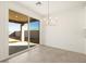 Bright dining area with sliding glass doors to backyard at 37422 W San Clemente St, Maricopa, AZ 85138