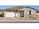 Single story home with a two-car garage and desert landscaping at 37422 W San Clemente St, Maricopa, AZ 85138