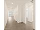 Bright hallway with tile flooring leading to other rooms at 37422 W San Clemente St, Maricopa, AZ 85138