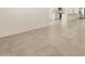 Living room with neutral tile flooring at 37422 W San Clemente St, Maricopa, AZ 85138