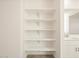 Open shelving in bathroom for extra storage at 37458 W San Clemente St, Maricopa, AZ 85138