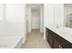Bathroom with a large soaking tub and double vanity at 37501 W San Clemente St, Maricopa, AZ 85138