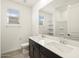 Bathroom with double vanity, and a large mirror at 37501 W San Clemente St, Maricopa, AZ 85138