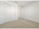 Simple bedroom with double door closet and carpet flooring at 37501 W San Clemente St, Maricopa, AZ 85138