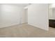 Spacious bedroom with neutral walls and carpet, and an ensuite bathroom at 37501 W San Clemente St, Maricopa, AZ 85138