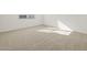 Well-lit bedroom with neutral carpeting and window with blinds at 37501 W San Clemente St, Maricopa, AZ 85138