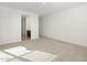 Bright bedroom with neutral walls, carpet, and ensuite bathroom access at 37501 W San Clemente St, Maricopa, AZ 85138