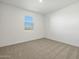 Spacious bedroom with neutral walls and carpet flooring at 37501 W San Clemente St, Maricopa, AZ 85138
