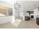 Modern kitchen with dark cabinetry, island, and breakfast area at 37501 W San Clemente St, Maricopa, AZ 85138