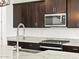 Modern kitchen features granite countertops and stainless steel appliances at 37501 W San Clemente St, Maricopa, AZ 85138