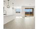 Modern kitchen with island, stainless steel appliances and sliding door to patio at 37501 W San Clemente St, Maricopa, AZ 85138