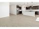 Open kitchen with stainless steel appliances and an island at 37501 W San Clemente St, Maricopa, AZ 85138