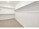 Spacious walk-in closet with double hanging rods and shelves at 37501 W San Clemente St, Maricopa, AZ 85138