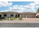 Attractive single-story home with a three-car garage, tidy landscaping, and a brick driveway at 21330 N 78Th St, Scottsdale, AZ 85255