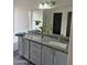 Bathroom featuring a double sink vanity, modern fixtures, and ample counter space at 6623 N 85Th Ave, Glendale, AZ 85305