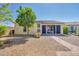 Backyard view with covered patio and pathway at 12368 W Running Deer Trl, Peoria, AZ 85383