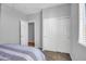Bedroom with carpet flooring, double door closet and additional access door at 12368 W Running Deer Trl, Peoria, AZ 85383
