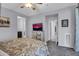 Main bedroom with TV and access to bathroom at 12368 W Running Deer Trl, Peoria, AZ 85383