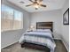 Bright bedroom featuring a ceiling fan and window blinds at 12368 W Running Deer Trl, Peoria, AZ 85383