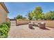 Charming courtyard with comfortable seating and lush landscaping at 12368 W Running Deer Trl, Peoria, AZ 85383