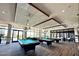 Game room with multiple pool tables and large windows at 12368 W Running Deer Trl, Peoria, AZ 85383