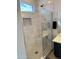 Modern shower with marble tile and glass enclosure at 12368 W Running Deer Trl, Peoria, AZ 85383