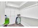 Spacious walk-in closet with ample shelving and hanging rods at 12368 W Running Deer Trl, Peoria, AZ 85383