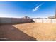 Large backyard with a block wall providing privacy and security at 4255 W Jeanette Ln, San Tan Valley, AZ 85144