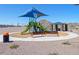 Community playground featuring slides, climbing area, seating, and a covered picnic area at 4255 W Jeanette Ln, San Tan Valley, AZ 85144