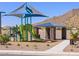 Community playground and picnic area featuring a shaded play structure and stone pavilion at 4255 W Jeanette Ln, San Tan Valley, AZ 85144