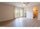 Bright bedroom with vinyl floors, windows for lots of light, and an ensuite bathroom and walk in closet at 4622 E Flower Ave, Mesa, AZ 85206